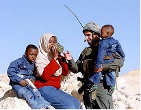 Israeli soldier with Darfur refugees